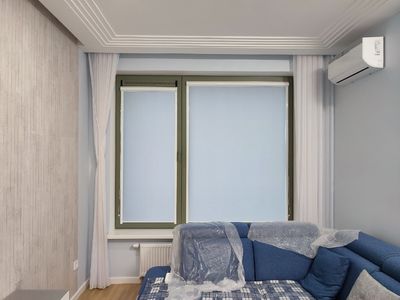 Кассетные рулонные шторы UNI 1 с тканью Альфа Blackout голубая